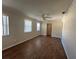 Living room with ceiling fan and wood-look tile at 707 Great Barford St, Auburndale, FL 33823