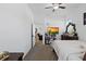 Bedroom with neutral carpet, ceiling fan, with tv, dresser, and comfortable aesthetic at 747 Fraser Ct, Kissimmee, FL 34759