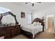 Cozy bedroom with dark wood furniture, and natural light at 747 Fraser Ct, Kissimmee, FL 34759