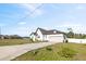 A beautiful exterior elevation of home and its long drive way and fenced in yard at 747 Fraser Ct, Kissimmee, FL 34759