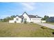 Charming two-story home with a well-manicured lawn, gray accents, and lovely landscaping at 747 Fraser Ct, Kissimmee, FL 34759