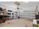 Spacious two car garage with shelving and garage door opener at 747 Fraser Ct, Kissimmee, FL 34759