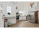 A nice kitchen featuring modern appliances, white cabinets, and vaulted ceilings at 747 Fraser Ct, Kissimmee, FL 34759