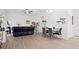 Bright and airy living room featuring an open floor plan and wood-look flooring at 747 Fraser Ct, Kissimmee, FL 34759
