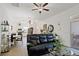 Bright living room with hardwood floors, ceiling fan, and open floor plan at 747 Fraser Ct, Kissimmee, FL 34759