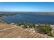 Stunning aerial view of waterfront property with lush landscaping and access to a beautiful lake at 819 Seminole Rd, Babson Park, FL 33827