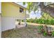 Elevated home featuring a spacious backyard with lush foliage and shade from mature trees at 819 Seminole Rd, Babson Park, FL 33827
