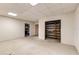 Spacious basement area with carpeted floors, shelving, and ample room for storage or hobbies at 819 Seminole Rd, Babson Park, FL 33827