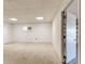 Finished basement with carpet, painted block walls, and bright lighting at 819 Seminole Rd, Babson Park, FL 33827
