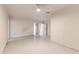 Spacious basement with painted block walls and white flooring, offering versatile space at 819 Seminole Rd, Babson Park, FL 33827