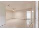Spacious basement with painted block walls, light tile flooring and ample room for activities at 819 Seminole Rd, Babson Park, FL 33827