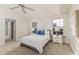Cozy bedroom featuring a comfortable bed, large windows, and stylish décor at 819 Seminole Rd, Babson Park, FL 33827