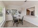 Bright dining area featuring neutral decor, a round table, and a pass-through to the kitchen at 819 Seminole Rd, Babson Park, FL 33827