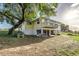 Two-story home with elevated balcony, partial basement, and a spacious yard at 819 Seminole Rd, Babson Park, FL 33827