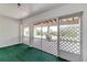 A screened porch provides outdoor living with views of the lake, blending indoor and outdoor relaxation at 819 Seminole Rd, Babson Park, FL 33827