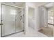 Modern bathroom featuring a glass enclosed shower with white tiled walls and chrome fixtures at 819 Seminole Rd, Babson Park, FL 33827