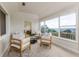 Inviting sunroom with comfortable seating and large windows offering scenic views at 819 Seminole Rd, Babson Park, FL 33827