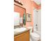 Bathroom featuring a mirror, sink, toilet, and bath tub at 908 Orista Dr, Davenport, FL 33897
