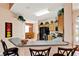 Open kitchen featuring wooden cabinets, black appliances, tile floor, and breakfast bar at 908 Orista Dr, Davenport, FL 33897