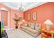 Cozy living room with comfortable seating, neutral decor, and warm lighting at 908 Orista Dr, Davenport, FL 33897