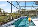 View of pool featuring spa and landscaping at 908 Orista Dr, Davenport, FL 33897