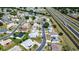 A cozy neighborhood featuring well-maintained homes and green lawns, with an adjacent multi-lane highway at 1055 Canary S Cir, Lakeland, FL 33809