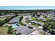 Community aerial showcasing a pool, tennis courts, and convenient access to the nearby highway at 1055 Canary S Cir, Lakeland, FL 33809