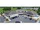 Aerial view showcases the community building surrounded by parking and lush landscaping at 1055 Canary S Cir, Lakeland, FL 33809