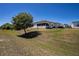 This home features a spacious backyard with mature shade trees and a screened in porch, perfect for enjoying the outdoors at 1055 Canary S Cir, Lakeland, FL 33809