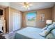 Comfortable bedroom featuring a queen bed with matching side tables and a bright window at 1055 Canary S Cir, Lakeland, FL 33809