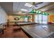 Billiard room with multiple tables and classic lighting, perfect for a friendly game at 1055 Canary S Cir, Lakeland, FL 33809
