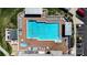 Overhead view of the community pool with lounge chairs and manicured grounds for resident enjoyment at 1055 Canary S Cir, Lakeland, FL 33809