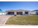 Charming single-story home featuring a brick driveway, screened in lanai, and well-maintained lawn at 1055 Canary S Cir, Lakeland, FL 33809