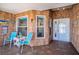 Cozy front porch with seating area, beach themed decor, and tiled flooring, perfect for relaxing at 1055 Canary S Cir, Lakeland, FL 33809