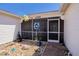 Charming front porch with decorative accents, screen door, and inviting entrance to the home at 1055 Canary S Cir, Lakeland, FL 33809