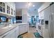 Bright kitchen with white cabinetry, modern appliances, and a seamless flow to the dining area at 1055 Canary S Cir, Lakeland, FL 33809