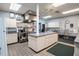 Functional kitchen with ample counter space, stainless steel appliances and tiled flooring at 1055 Canary S Cir, Lakeland, FL 33809