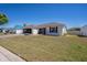 Charming single-story home featuring a well-manicured lawn and inviting curb appeal at 1055 Canary S Cir, Lakeland, FL 33809