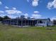 Backyard with a covered patio, pool, and fire pit at 121 Bonnie Dr, Auburndale, FL 33823