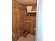 Organized closet space features shelving and clothing rods, offering practical storage solutions with additional storage on top shelf at 121 Bonnie Dr, Auburndale, FL 33823