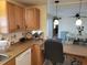Efficient kitchen design with countertops, a dishwasher, and an open layout towards the dining area at 121 Bonnie Dr, Auburndale, FL 33823
