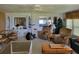 Open living area featuring a dining table, cozy seating, and bright interior at 121 Bonnie Dr, Auburndale, FL 33823