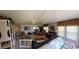 Wide living room with cozy seating areas and multiple sources of natural light at 121 Bonnie Dr, Auburndale, FL 33823