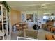 Bright living space with dining area, white built-in cabinets, and comfortable seating at 121 Bonnie Dr, Auburndale, FL 33823