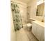 Standard bathroom featuring a shower-tub combo and a vanity sink with cabinet storage at 1219 Club Cir, Lakeshore, FL 33854