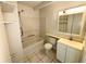Clean bathroom featuring a shower-tub, tiled floors, and functional vanity at 1219 Club Cir, Lakeshore, FL 33854