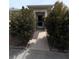 Inviting front entrance with well-maintained landscaping leading to the front door at 1219 Club Cir, Lakeshore, FL 33854