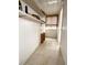 Hallway with storage shelving at 1219 Club Cir, Lakeshore, FL 33854
