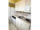 Well-lit kitchen featuring white appliances and ample counter space at 1219 Club Cir, Lakeshore, FL 33854