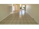 Generously sized living area with tile floors, ceiling fan, and neutral decor at 1219 Club Cir, Lakeshore, FL 33854